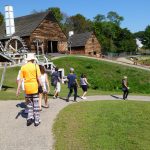 Participants go on a guided tour at Saugus Ironworks as part of Trails and Sails
